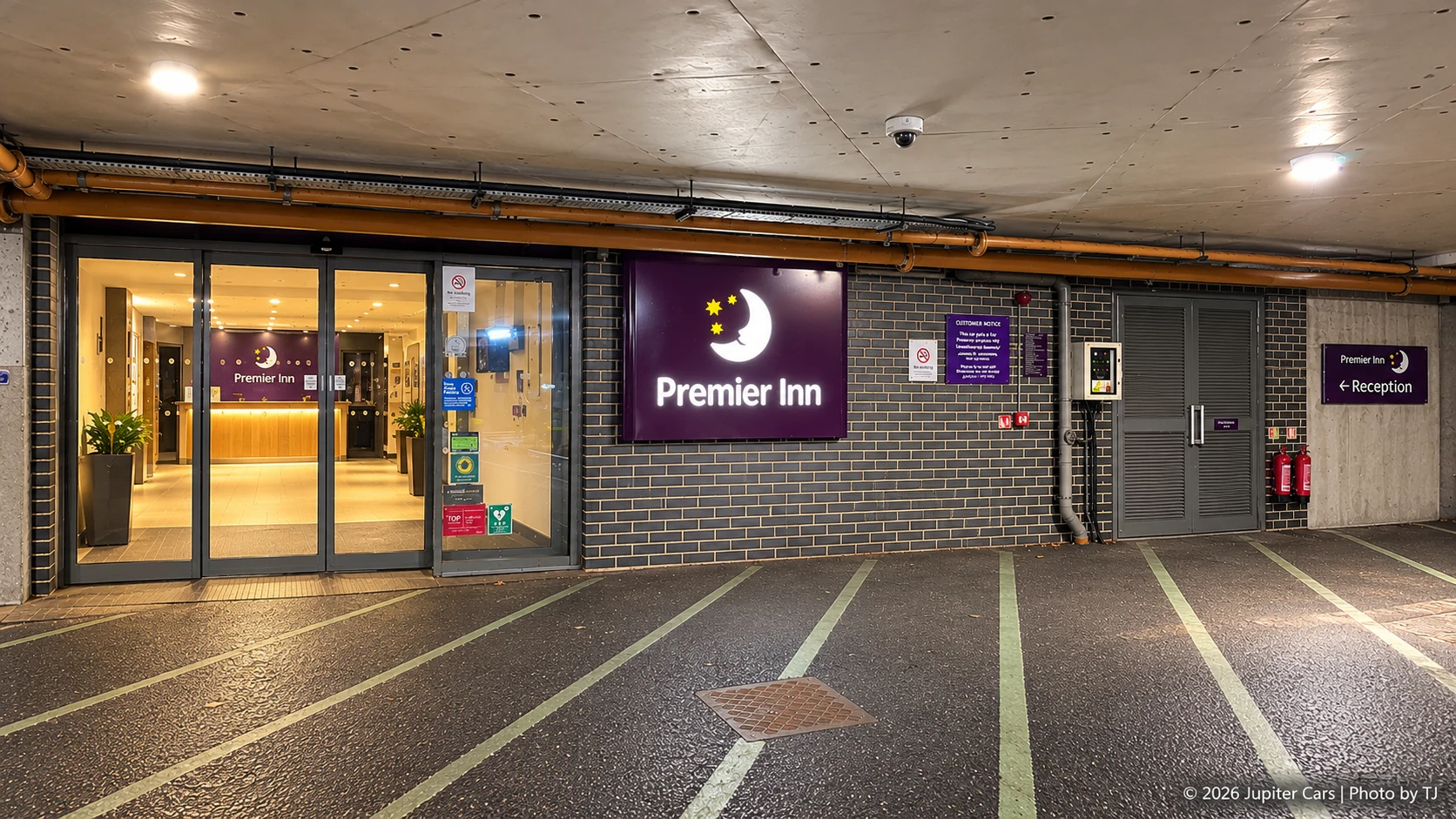 Basement reception entrance used for Jupiter Cars pickup and drop-off at Premier Inn Heathrow Terminal 4