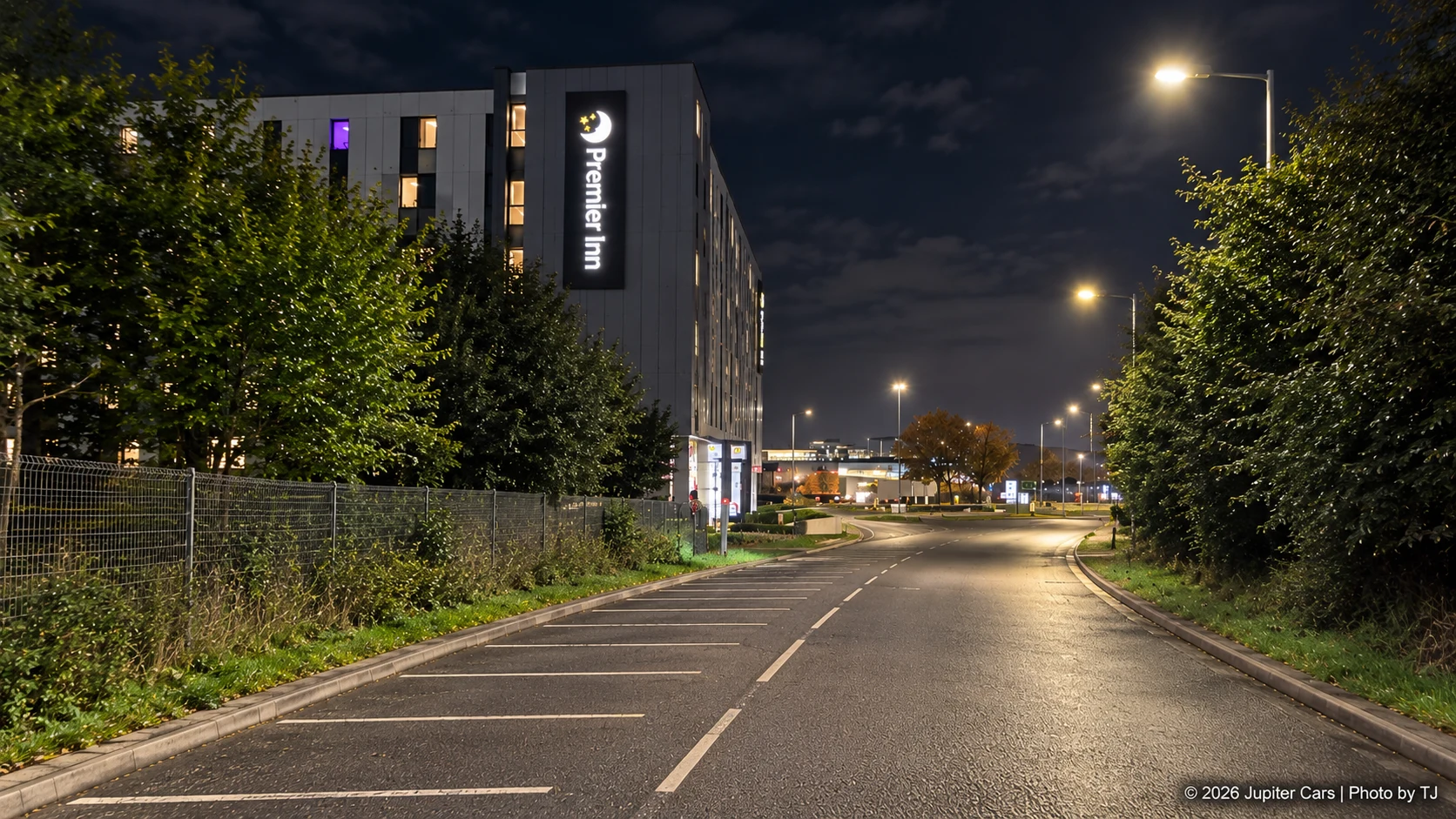Premier Inn Heathrow Terminal 4 exterior beside the approach road at night